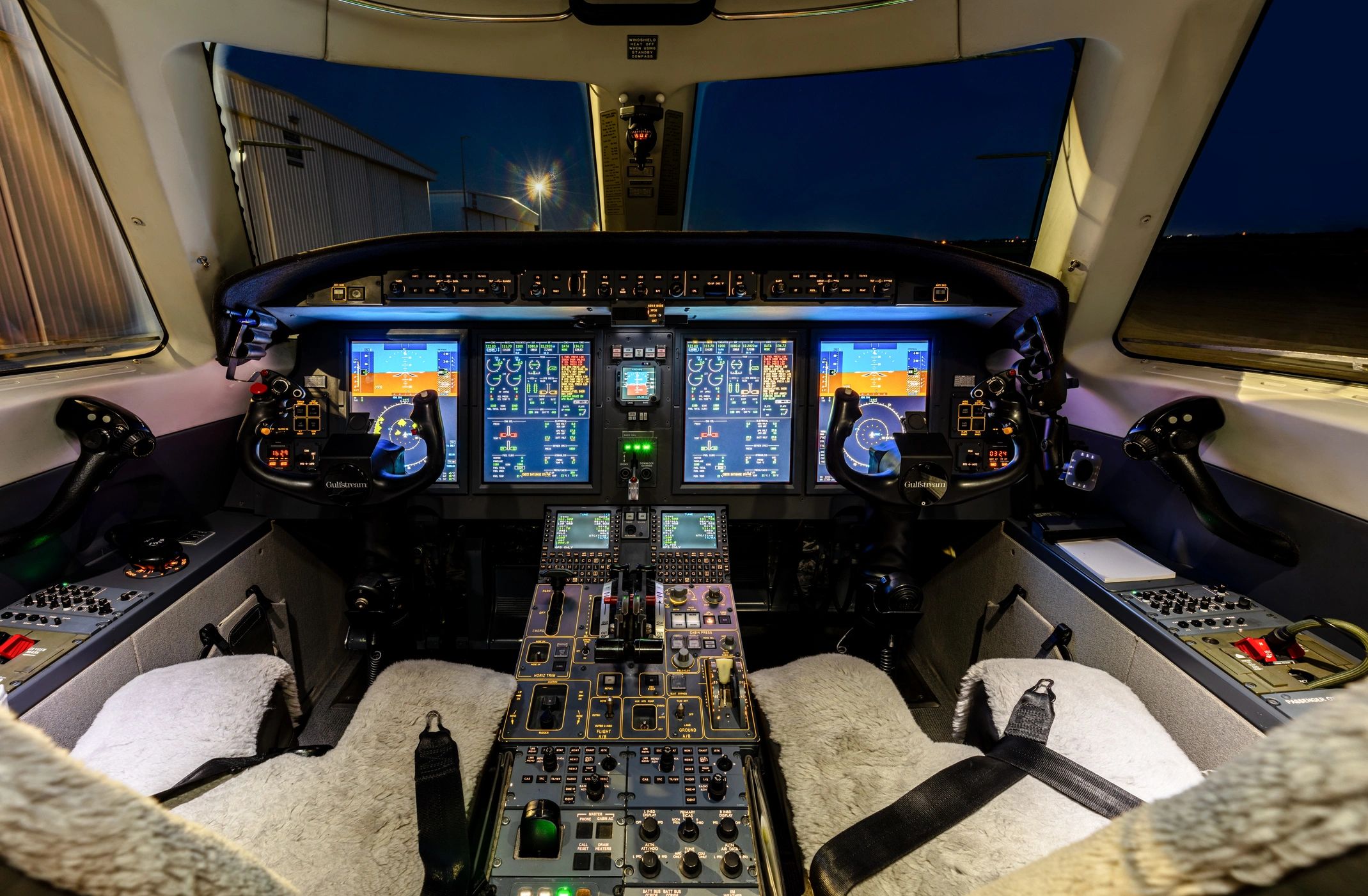 Aircraft cockpit with illuminated instrument panel during instrument flight conditions